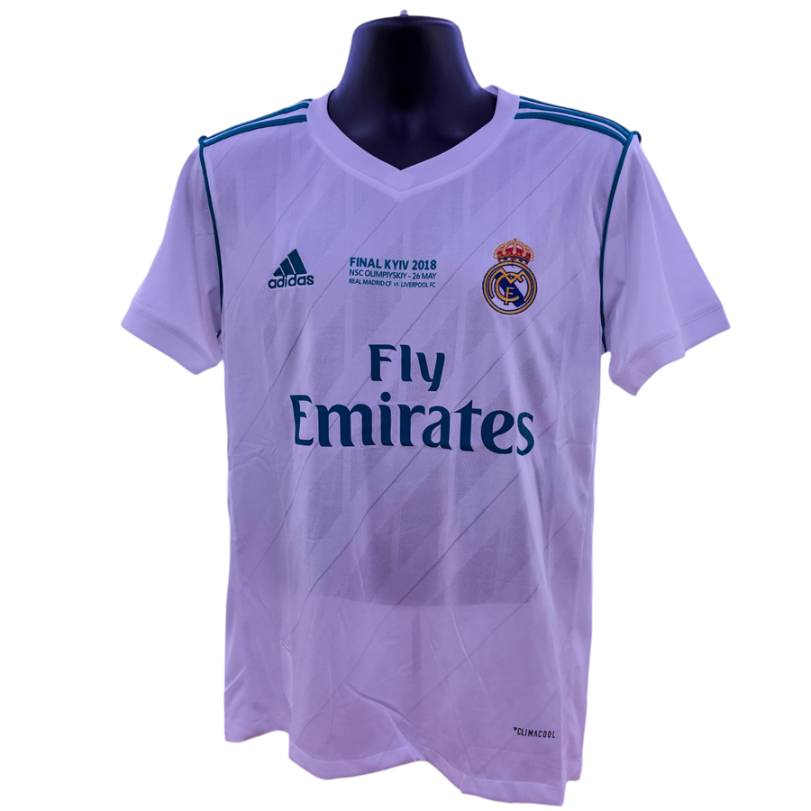 Light white sports jersey with Adidas and Real Madrid logos on a mannequin against a white background